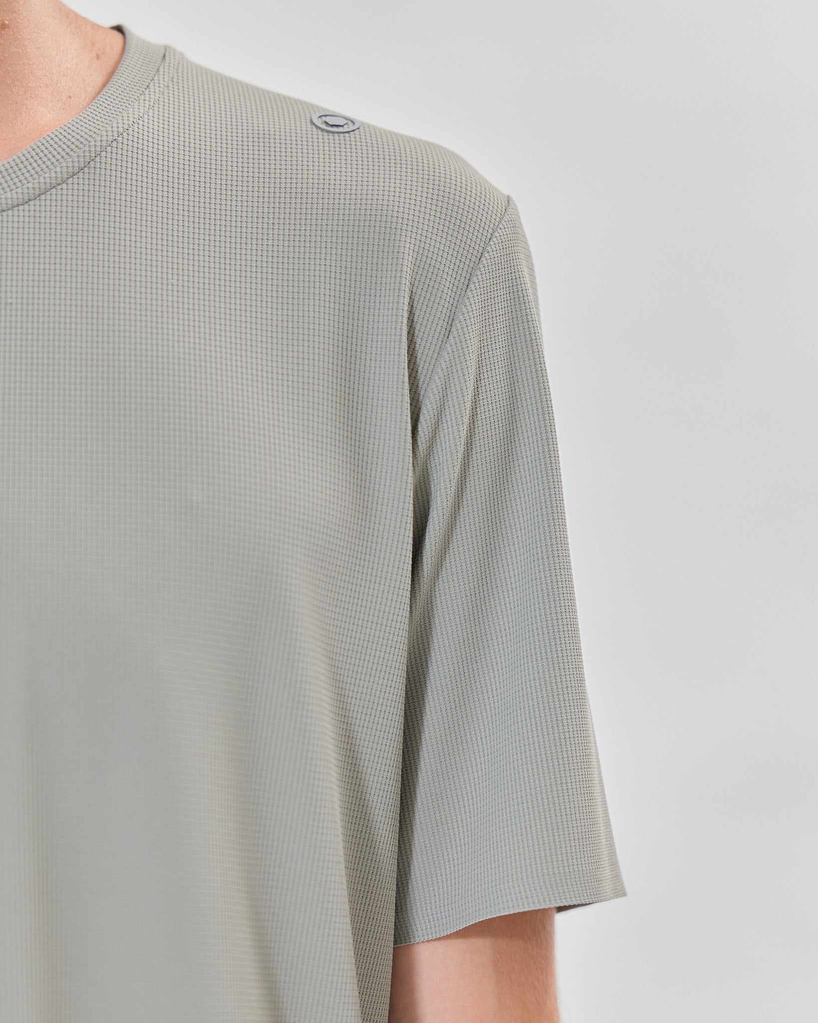 Moss green training t-shirt with breathable fabric and heat-bonded seams.