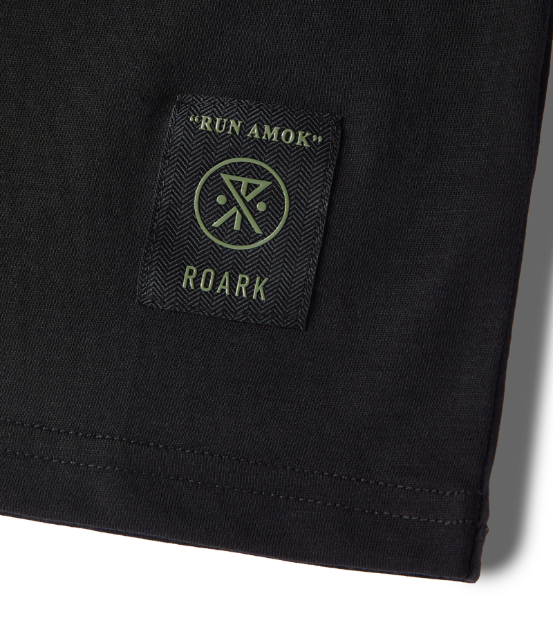 Mathis Core Shop Running Tee with Run Amok label on dark fabric.