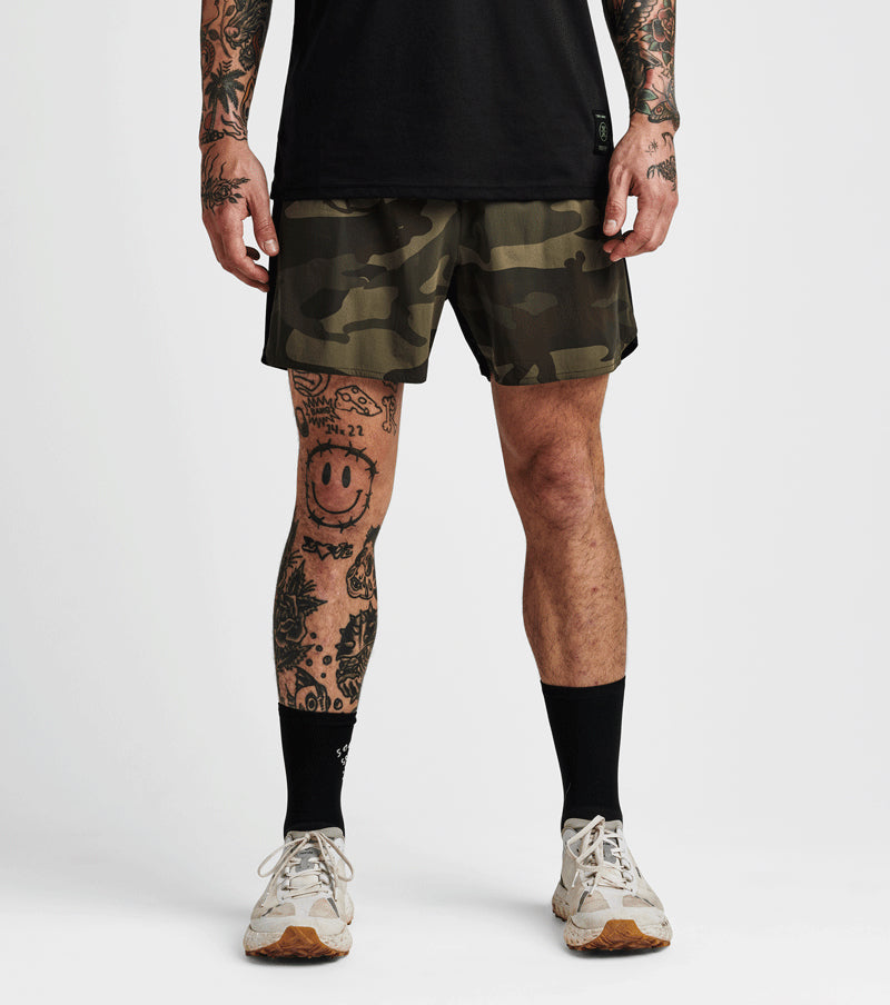 Alta Shorts 5" in camo pattern, lightweight 4-way stretch nylon with moisture-wicking liner, featuring rear zip pocket and gel stow pockets.