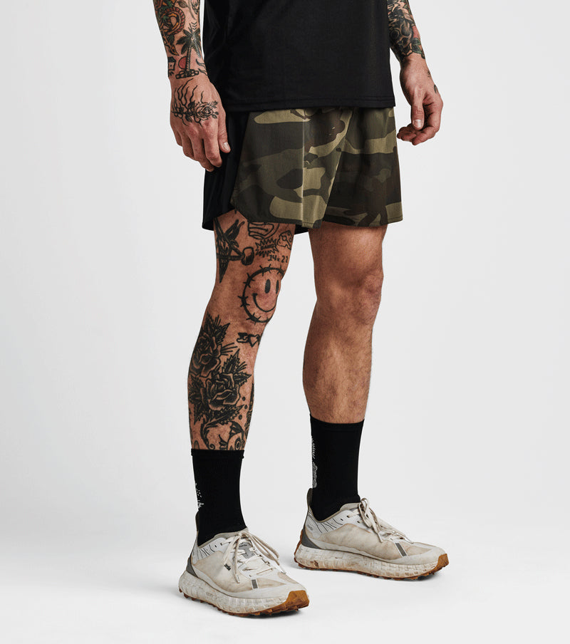 Alta Shorts 5" camo pattern with lightweight 4-way stretch, moisture-wicking liner, and rear zip pocket.