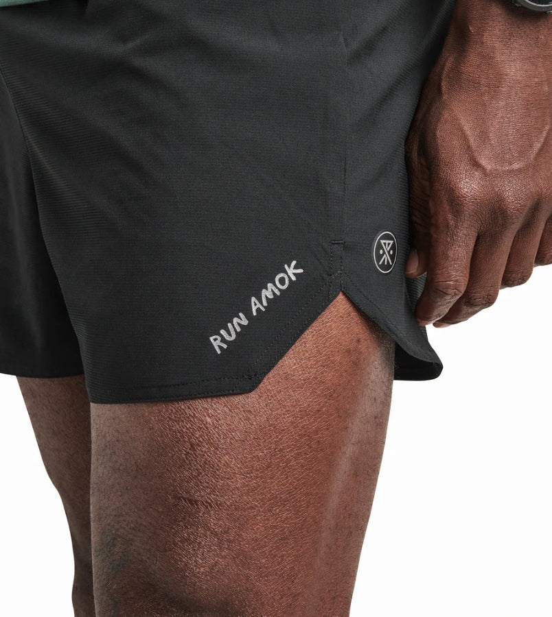 Baja Shorts 5" for running with lightweight stretch fabric and reflective logos.