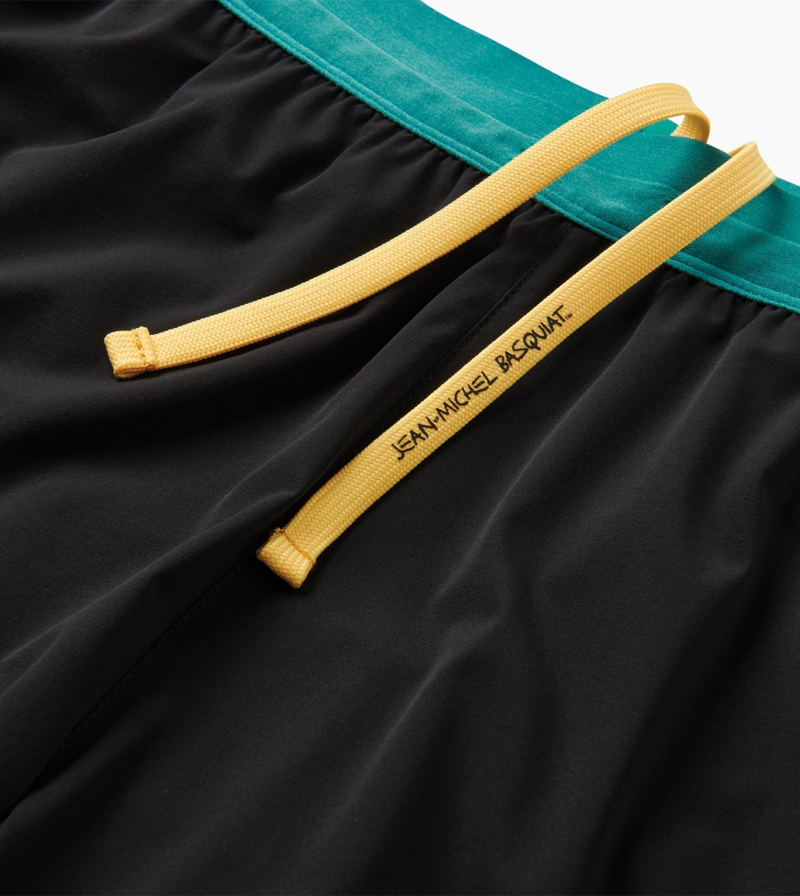 Alta Shorts 5" with Jean-Michel Basquiat art, yellow drawstring, green waistband.