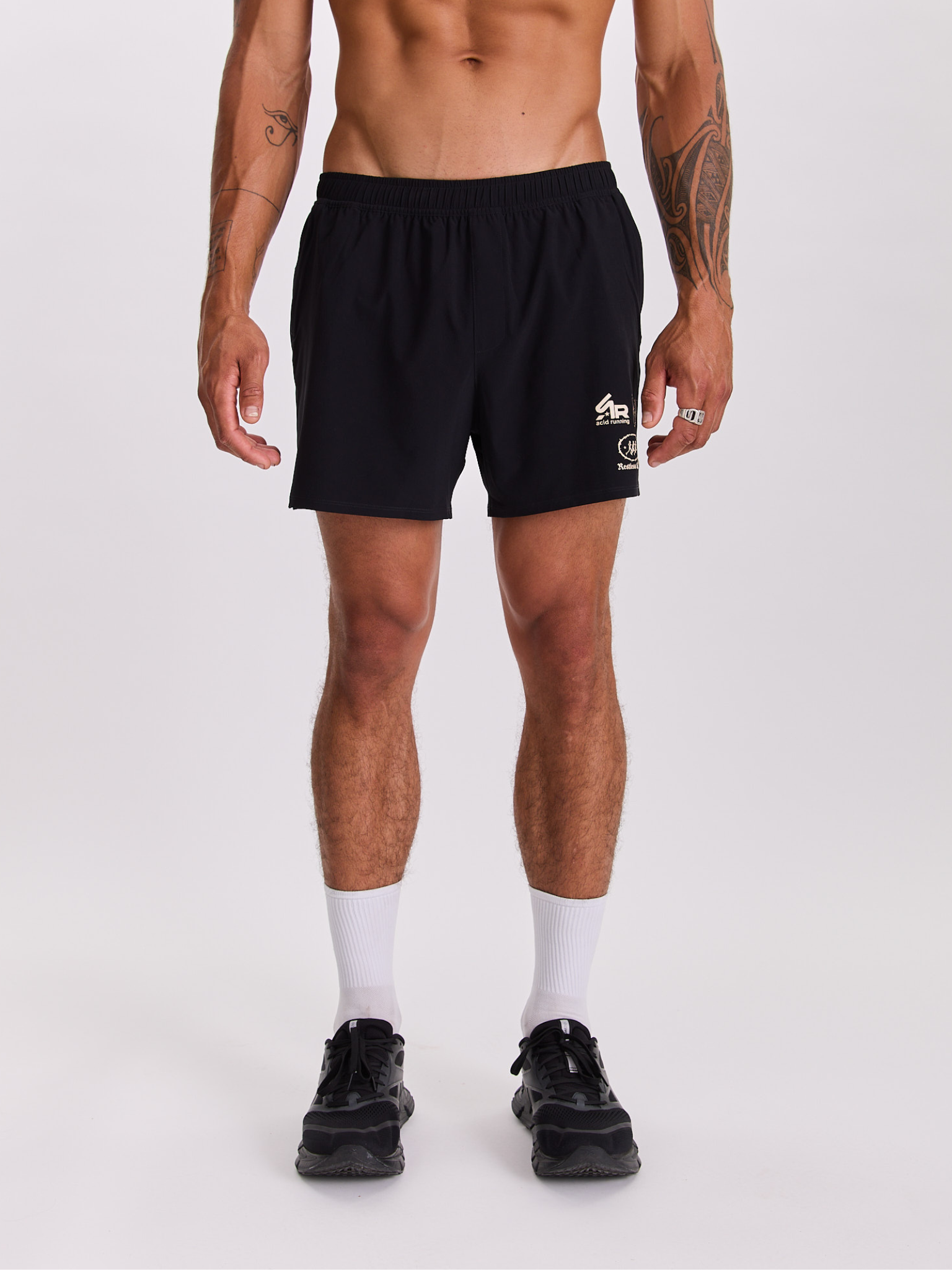 Men's Race Unit Shorts in black lightweight fabric featuring off-white logo graphics and an elastic waistband for comfort.