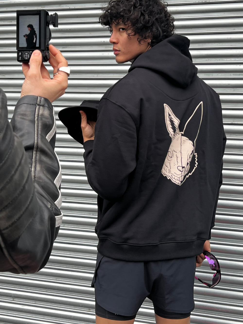 Logo Hoodie - Black with off-white logo embroidery and acid hare print, made from 100% organic cotton.