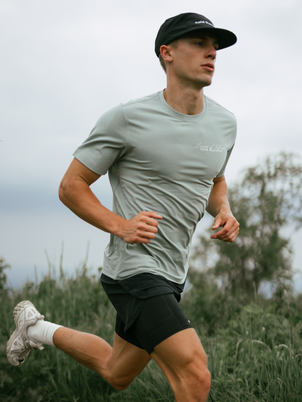 Man running in Runner's Fate T-Shirt, Iced Green, sweat-wicking and odour resistant.