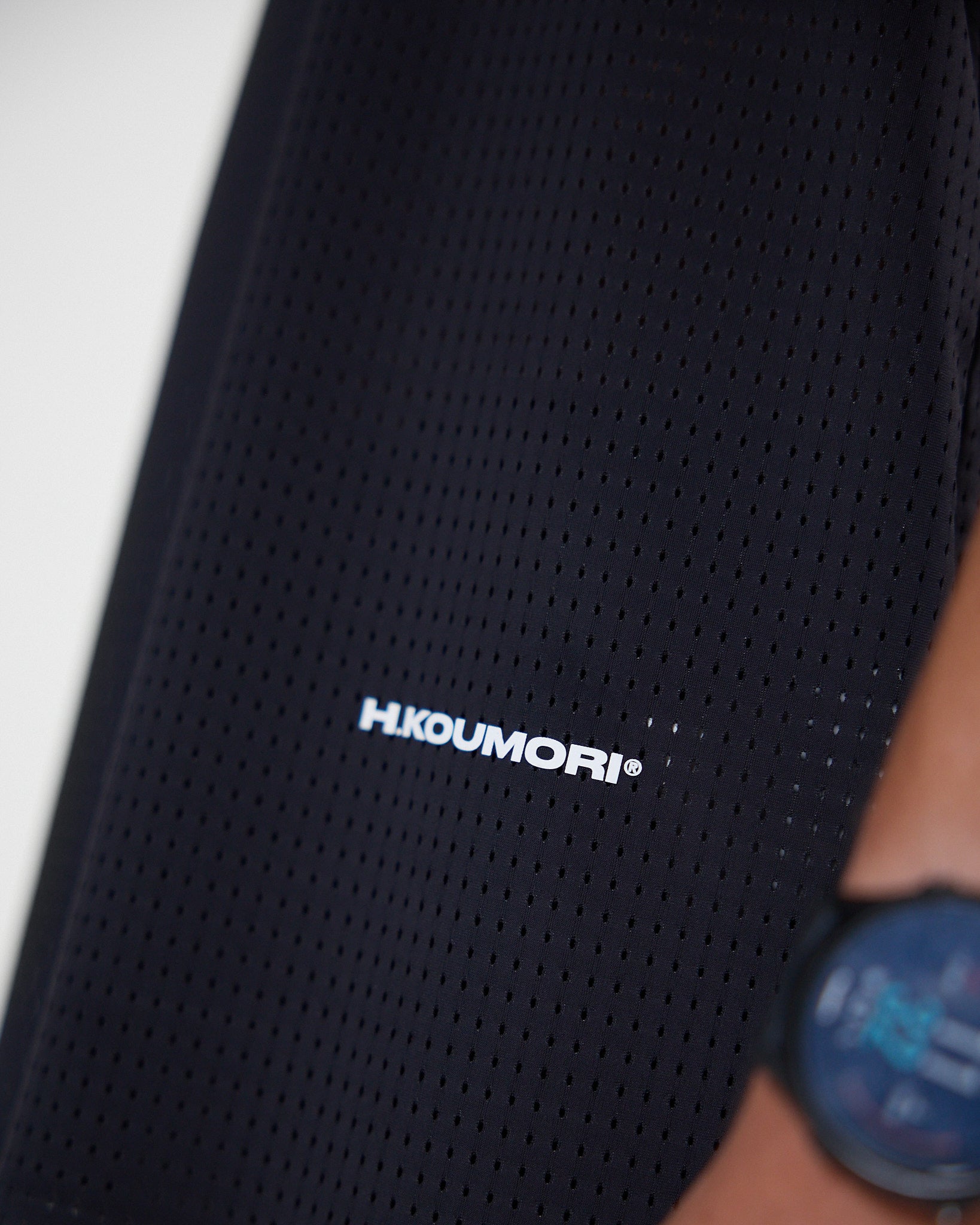 Koumori Training Singlet with HD reflective logo and breathable fabric.