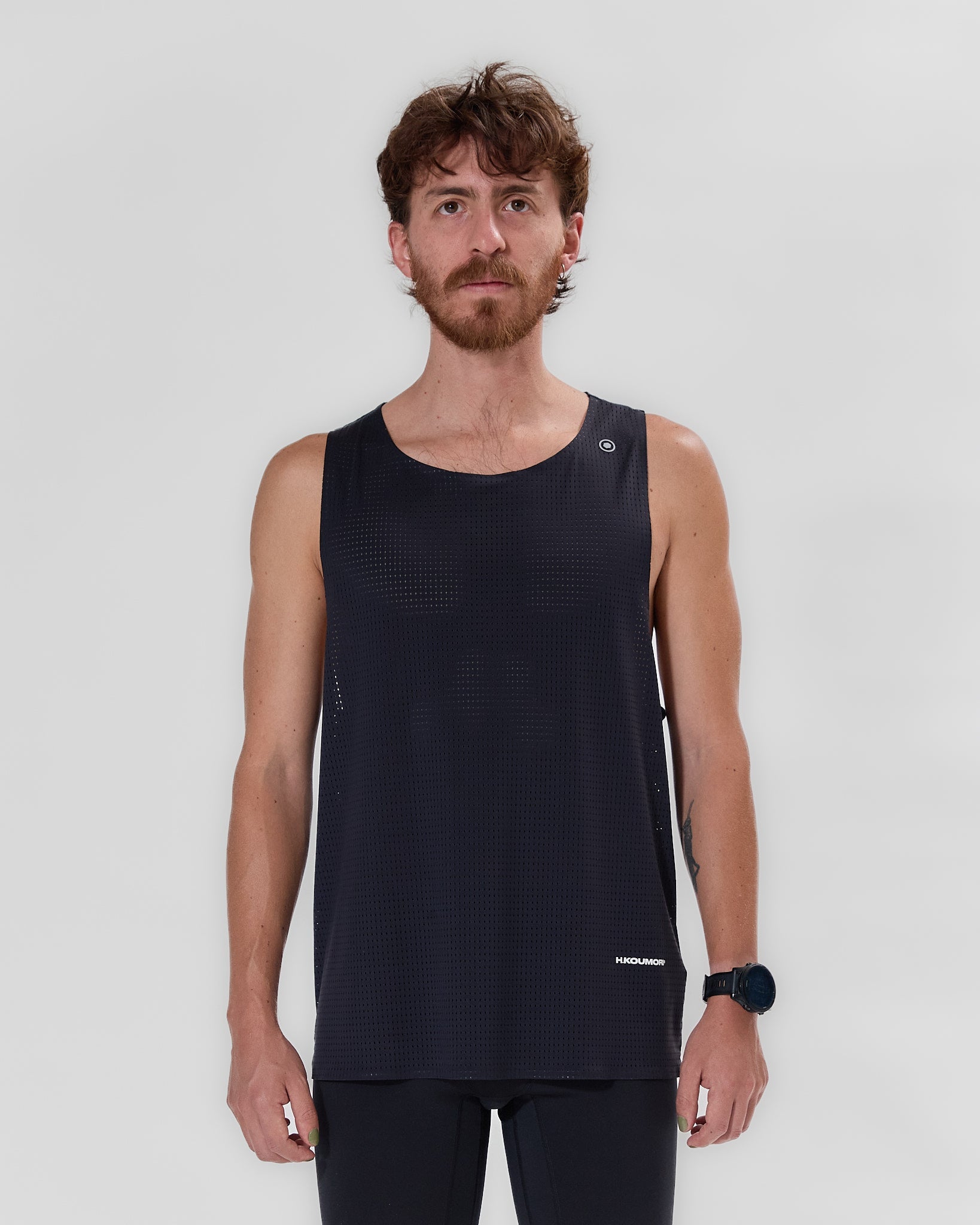 Koumori Training Singlet - breathable running singlet in black worn by a model.