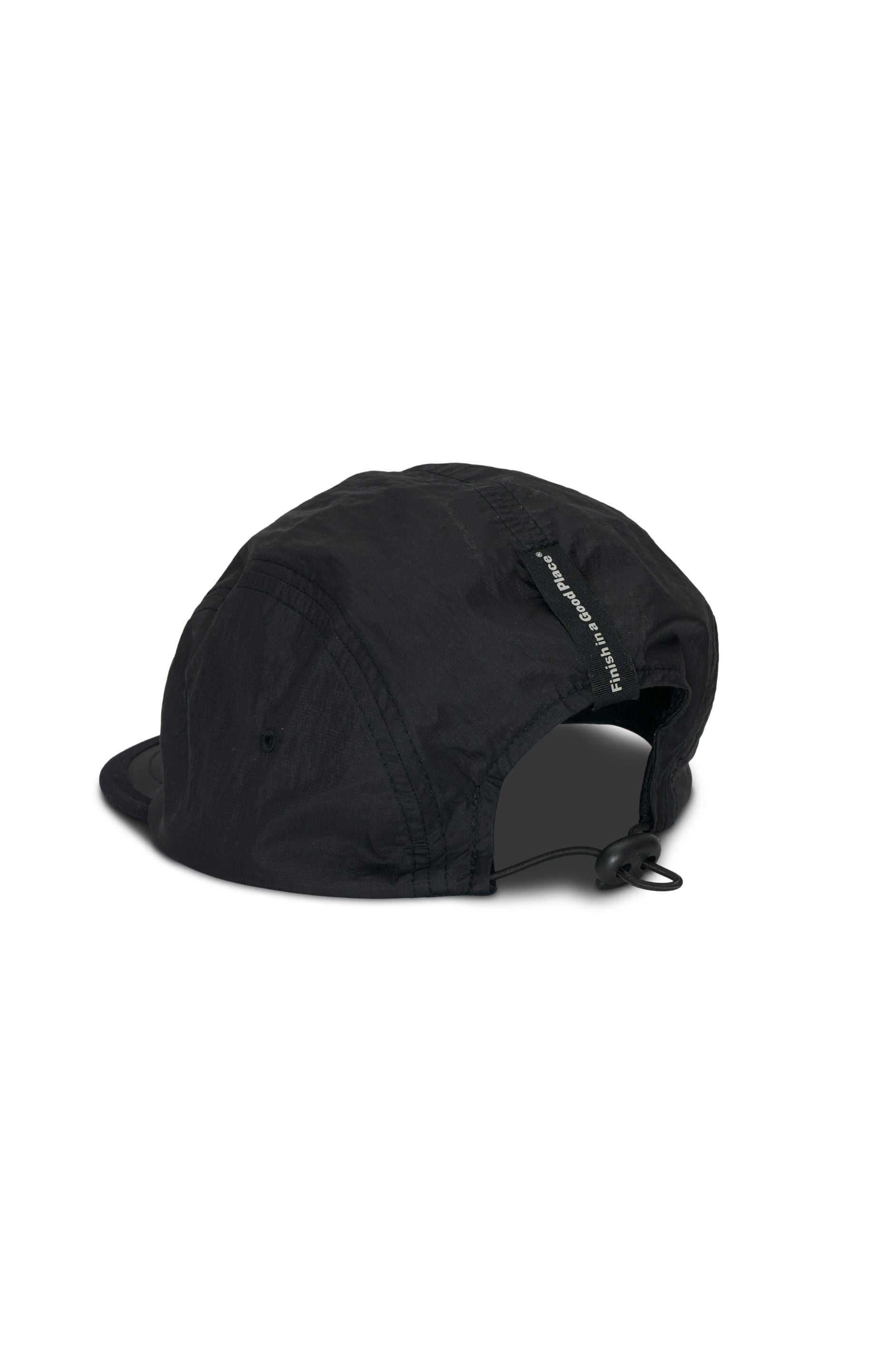 Unisex black running cap made from lightweight GRS recycled polyester, featuring DWR PFC-free water repellency, adjustable strap, and front UNNA logo.
