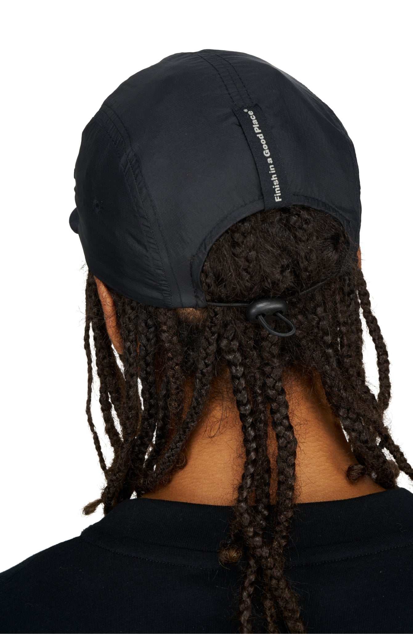 Unisex black running cap with DWR PFC free water repellent GRS recycled polyester and adjustable strap.
