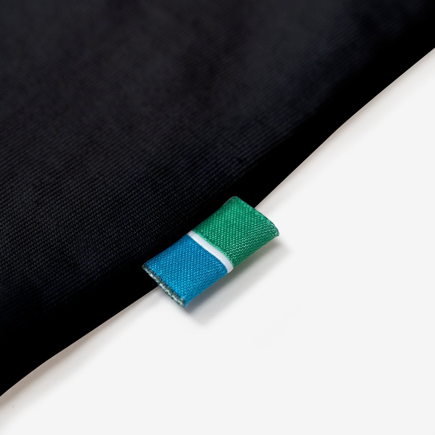 Track & Trail Organic Cotton Tee with sustainable tag detail.