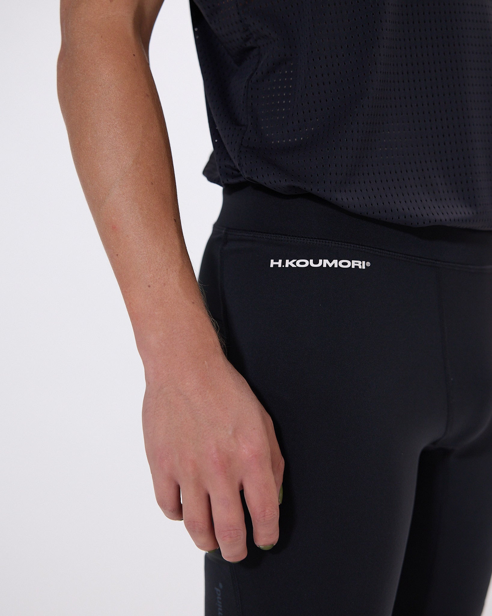 Koumori Training Tights with multi-pocket design and breathable fabric.