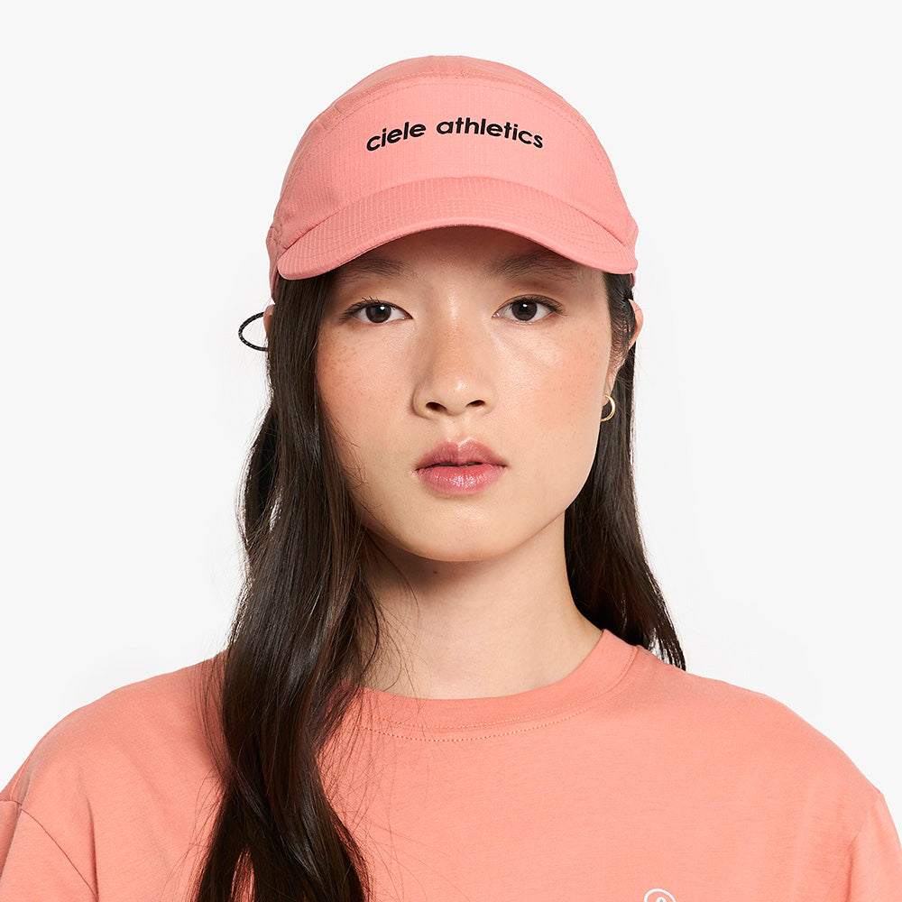 pink FSTCap SC running cap with soft curved brim and breathable mesh panels by Ciele Athletics