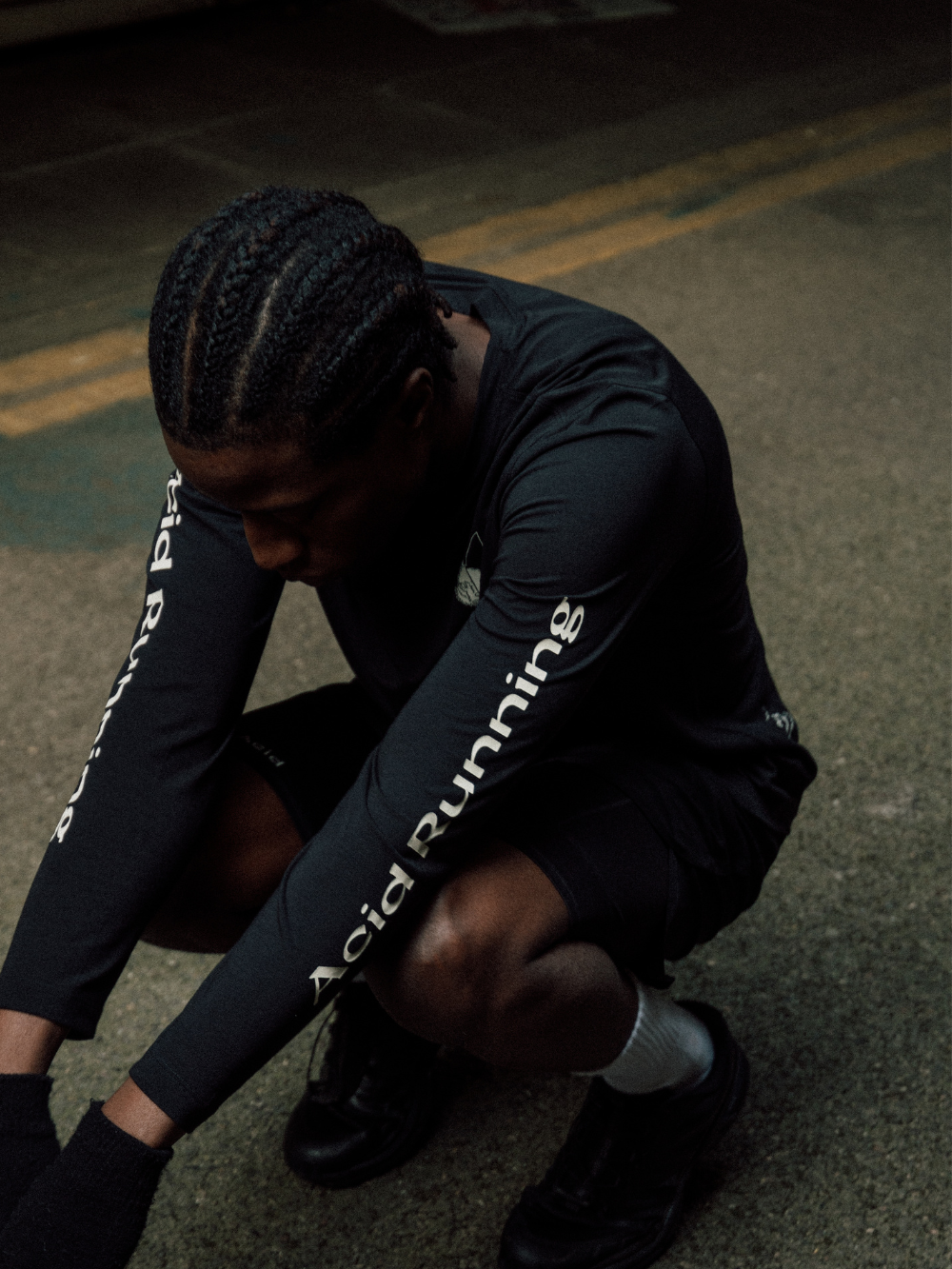 Long sleeve black T-shirt with white prints, showcasing advanced fabric design for performance and comfort.