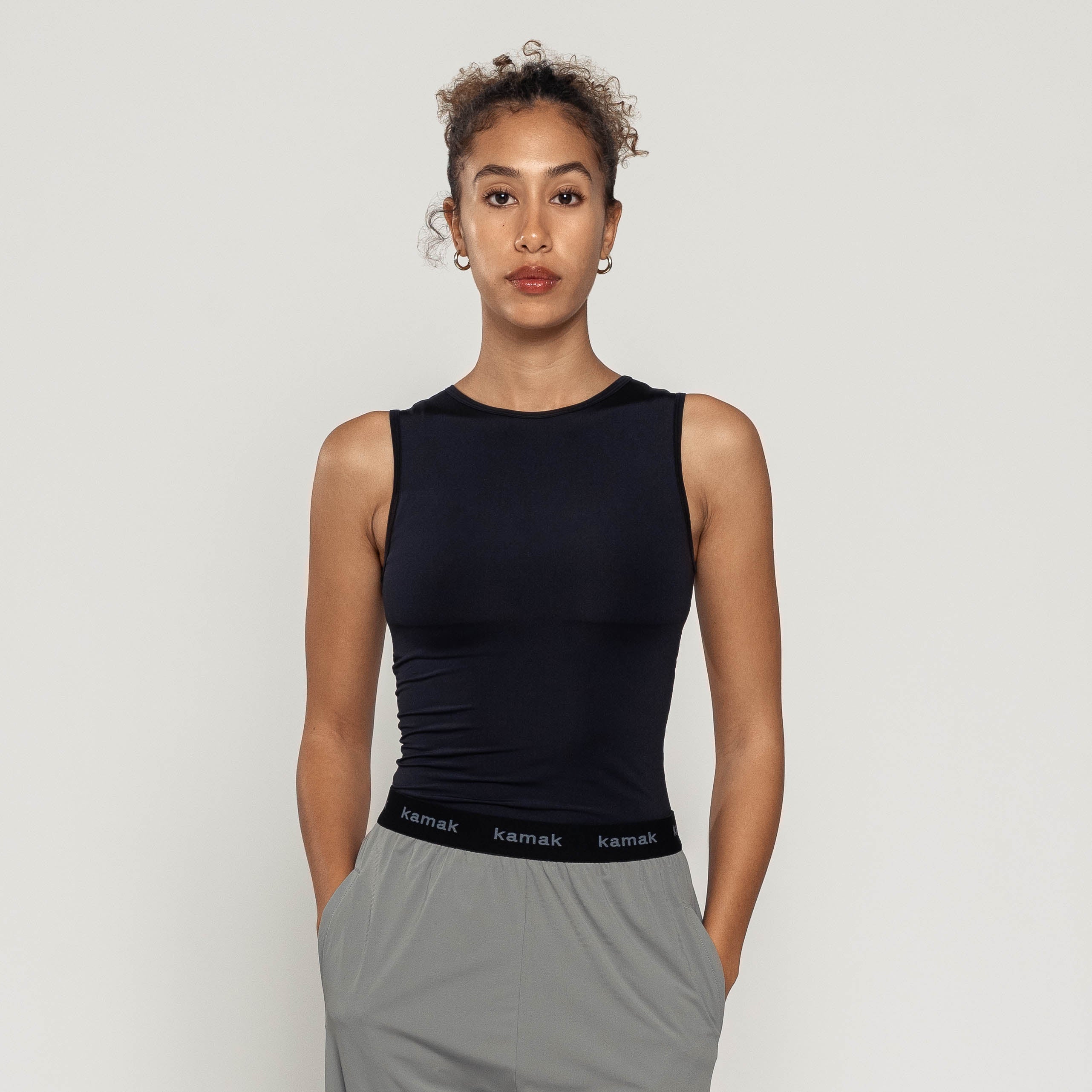 Black Tank-T worn by model, ultra-soft fabric, comfortable fit, versatile for various occasions.