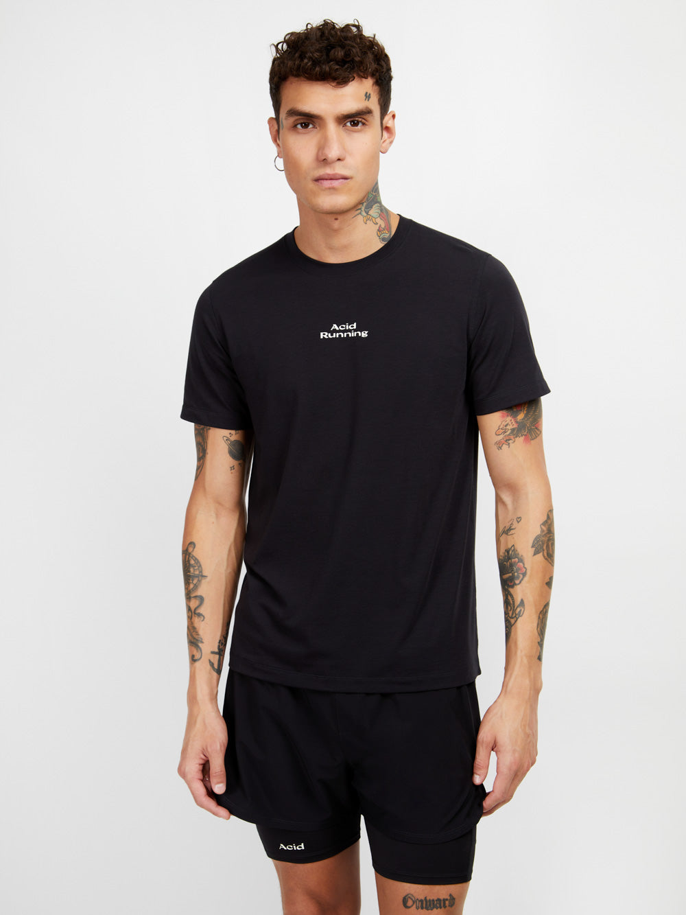 Black logo t-shirt with white print, ultra lightweight, sweat-wicking, odor resistant, ethically made with organic and recycled fabrics.