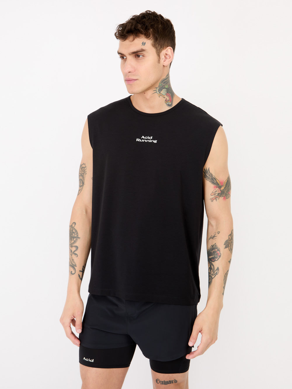Black logo tank; ultra lightweight, sweat-wicking, odor-resistant; deep off-black with white logo; ethically made from organic and recycled fabrics; relaxed fit.
