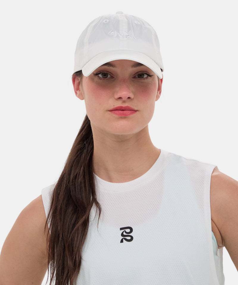Embroidered Bandit Nylon Dad Hat in white with reflective logo, featuring breathable sweat-wicking design.
