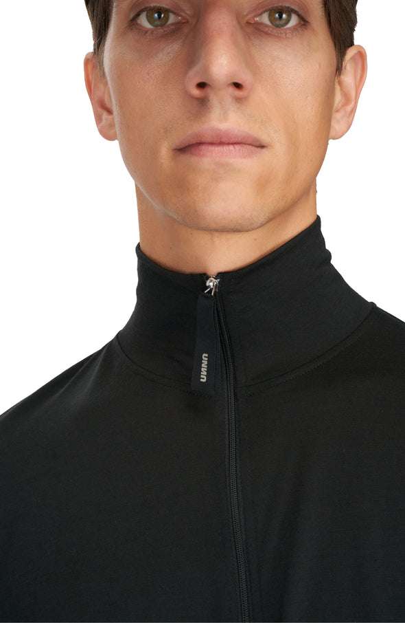 Men's black long sleeve running wool layer with high collar and zip.