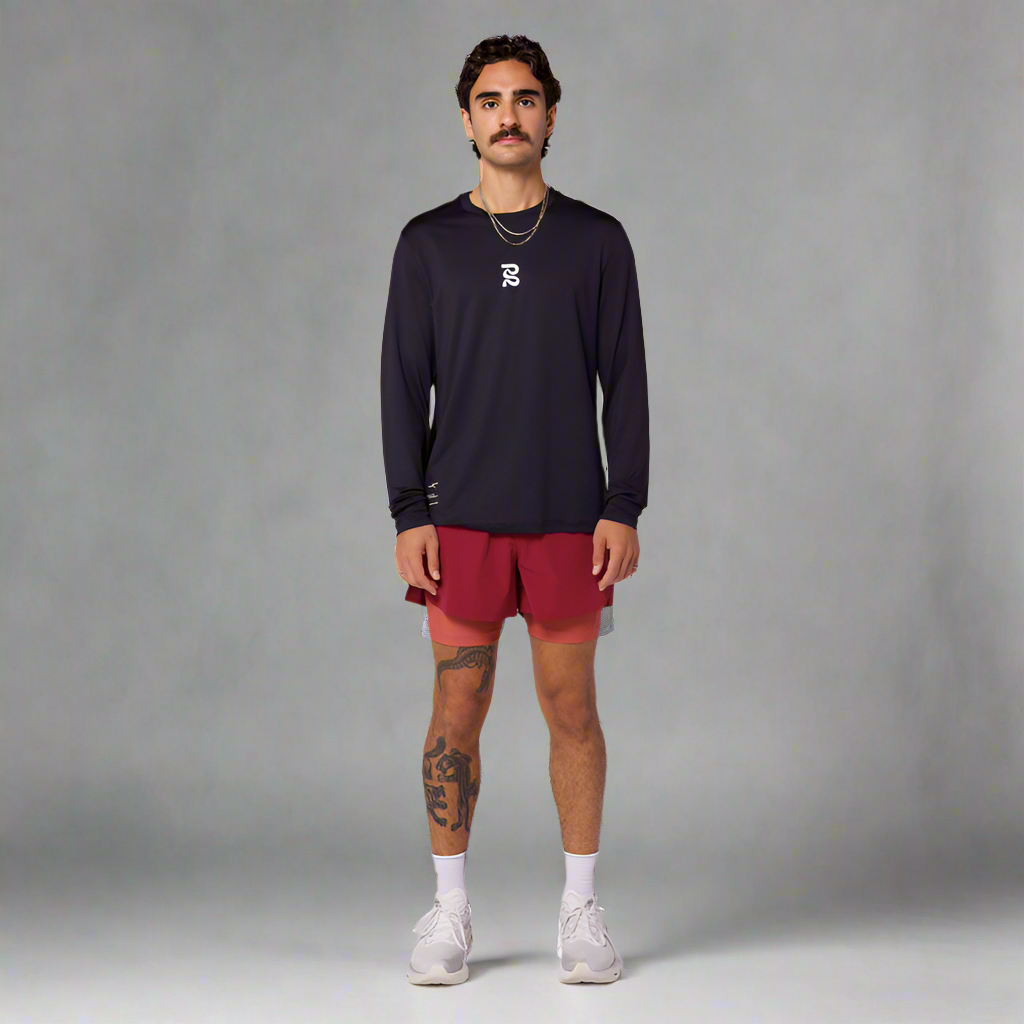 Men's athletic model wearing Vento™ 4" 2-in-1 Shorts in Cherry/Spice, demonstrating performance fit with moisture-wicking fabric.