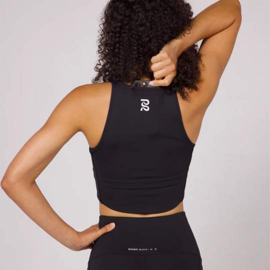 Stamina Luna Race Crop with phone pocket, back view showcasing reflective graphic and high-performance fabric.