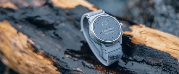 COROS APEX 2 GPS outdoor watch in grey on a log.