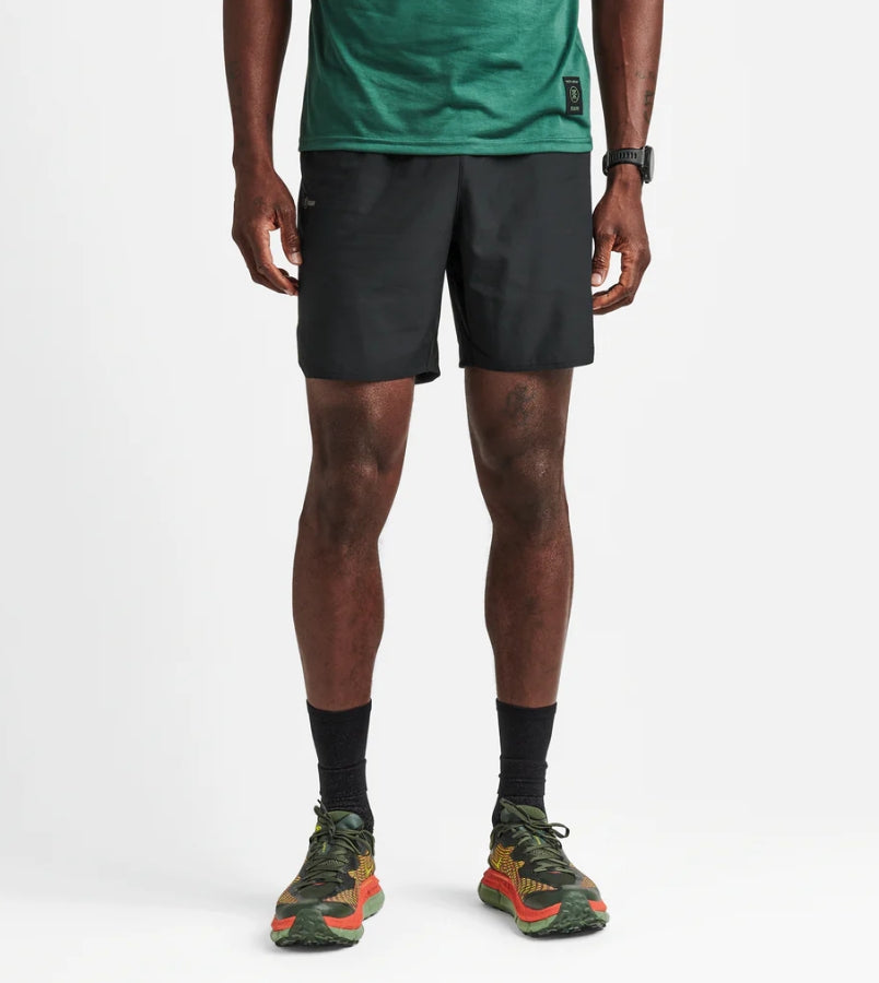 Baja Shorts 7" in black, featuring quick-drying polyester stretch fabric, elastic waistband, and reflective logos.