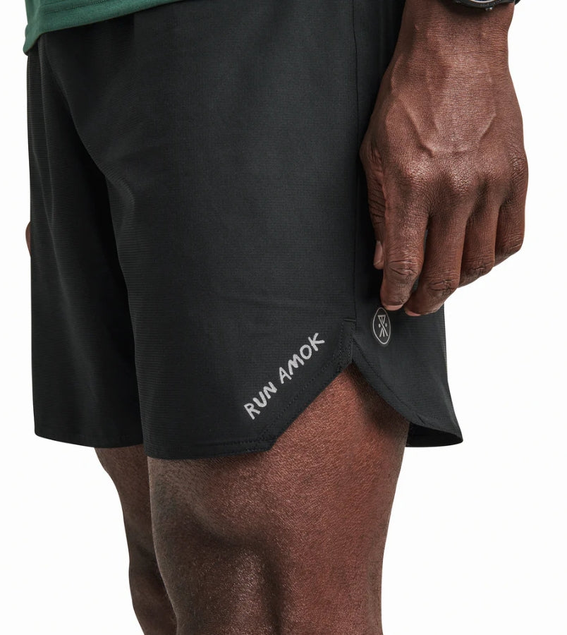 Baja Shorts 7" for running with lightweight stretch fabric and reflective logos.