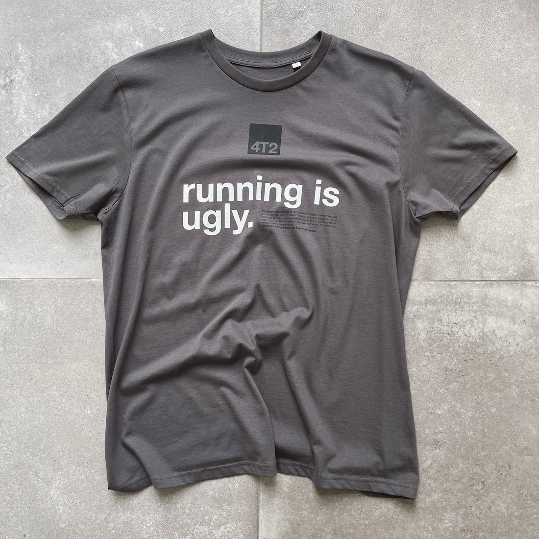 Anthracite unisex tee with "running is ugly" slogan, 100% organic cotton, relaxed fit.
