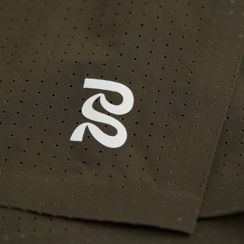 Perforated fabric detail of Vento™ Men's 3" Splitty Short with subtle reflective logo.