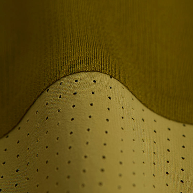 Close-up of Vento™ Performance Singlet's textured and pieced fabric showcasing micro-perforations.