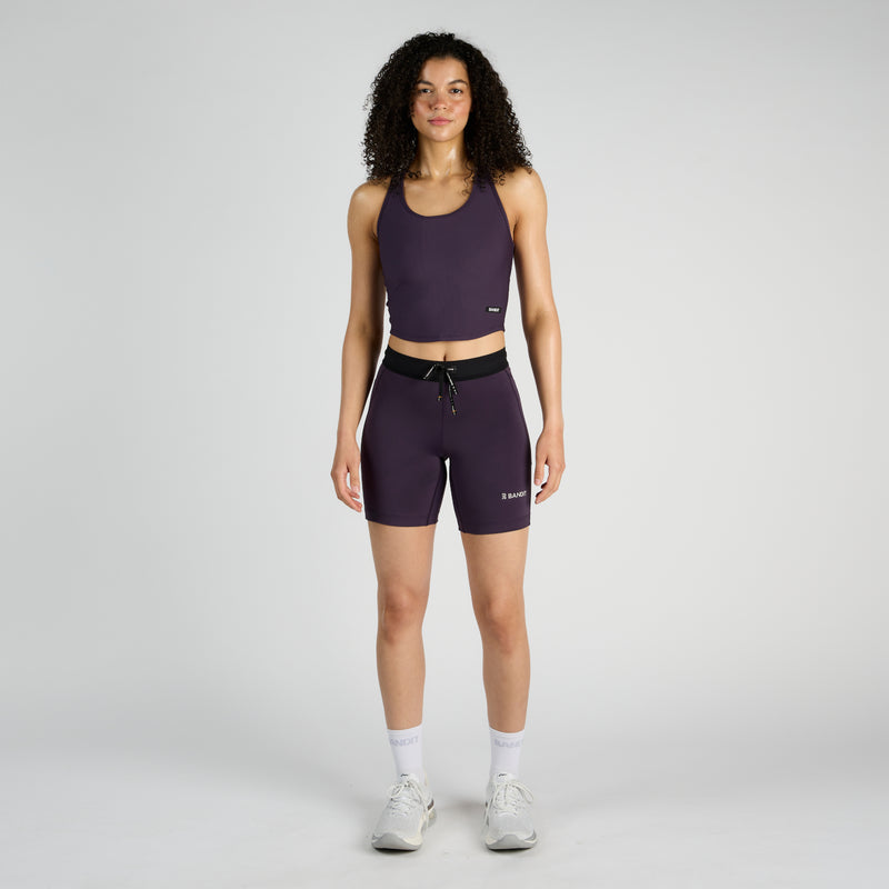 Stamina™ 7" Women's Compression Shorts in Nightshade, with a seamless fit and dual side pockets.