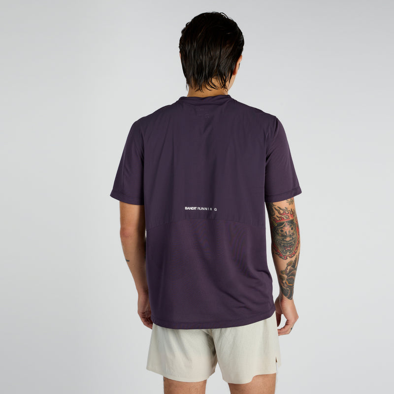 Vento™ Performance Tee Pieced in purple, featuring reflective graphics and optimized breathability.