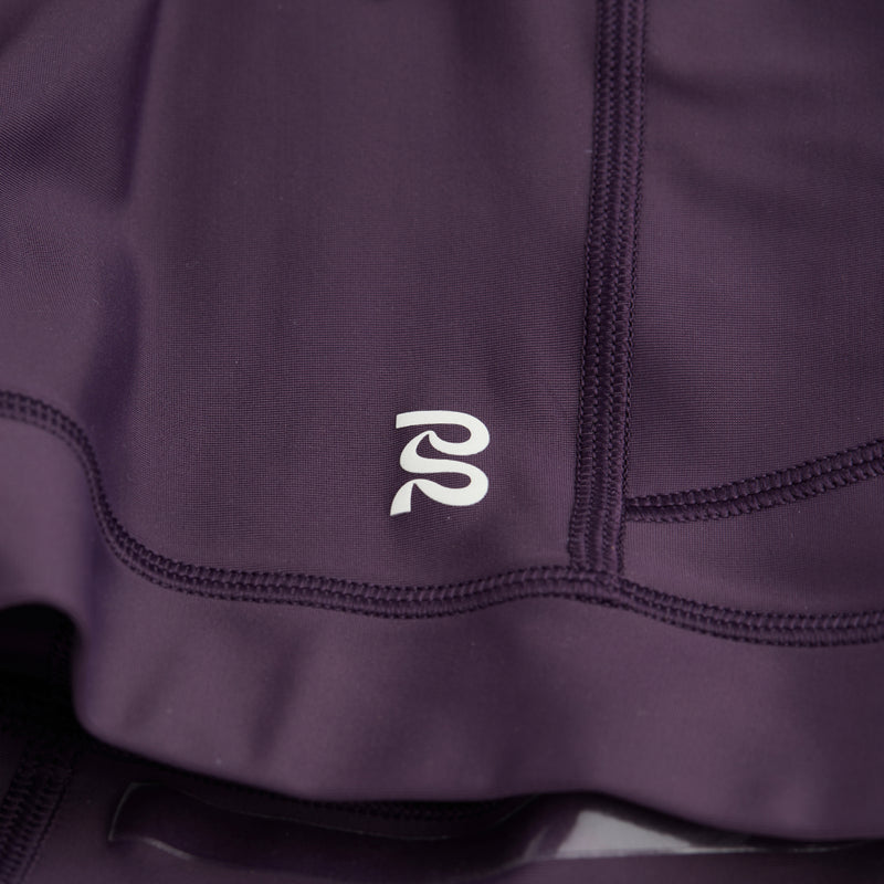 Superbeam™ Gen 7 Pocket Quarter Tights with reflective branding detail.