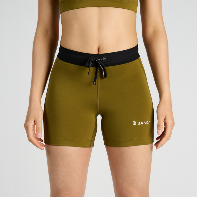 Stamina™ 5" women's compression shorts with dual side pockets and zippered stash pocket.