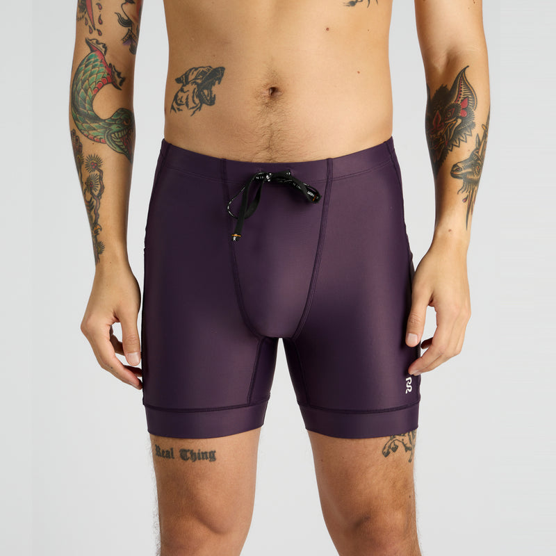 Gen 7 Pocket Quarter Tights for men with multiple pockets and reflective branding.