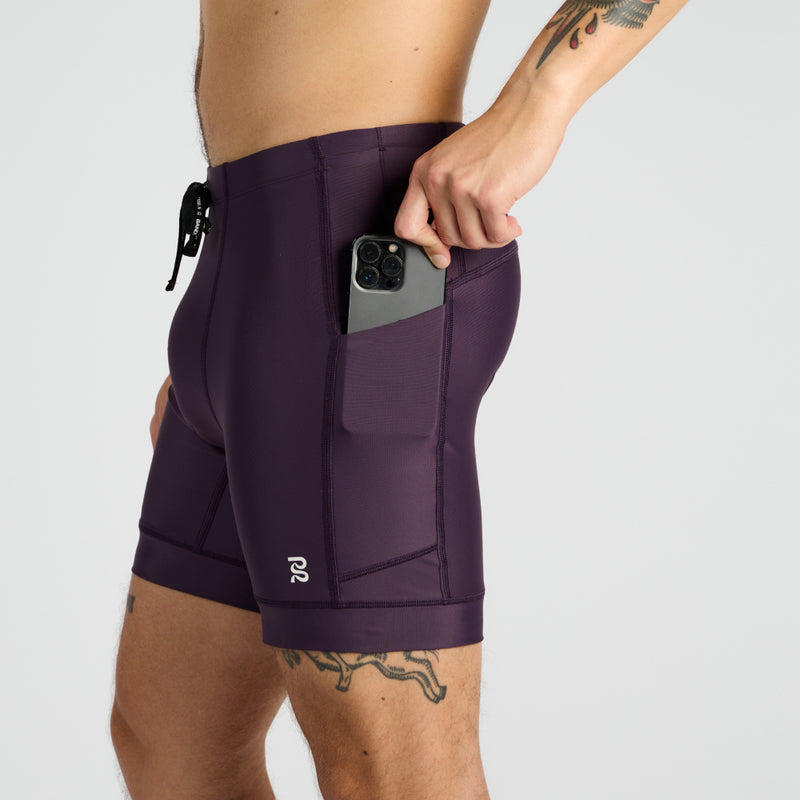 Gen 7 Pocket Quarter Tights with side phone pocket and purple design, featuring advanced performance fabric.