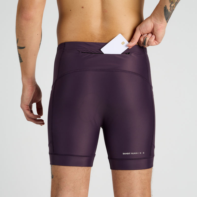 Gen 7 Pocket Quarter Tights with zippered stash pocket and reflective branding.