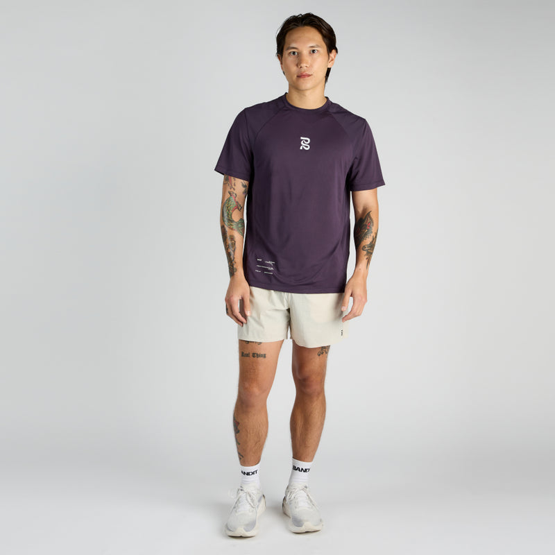 Vento™ Performance Tee Pieced, breathable athletic wear with crew neckline and reflective accents.