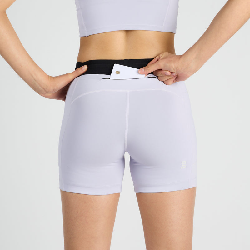 Stamina™ 5" Women's Compression Shorts with zippered stash pocket and reflective logos.