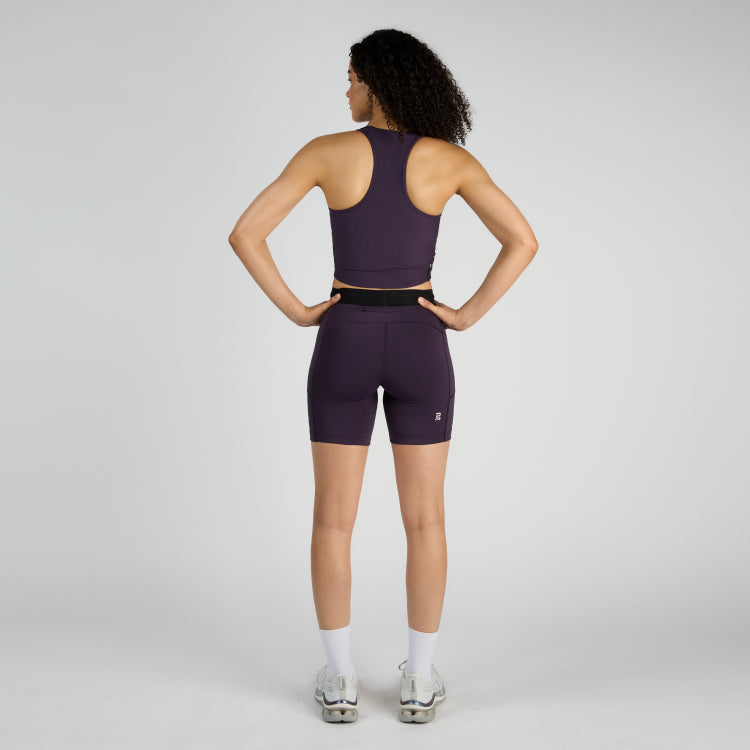 Stamina 7" Women's Compression Shorts in Nightshade with dual side pockets and reflective logos.