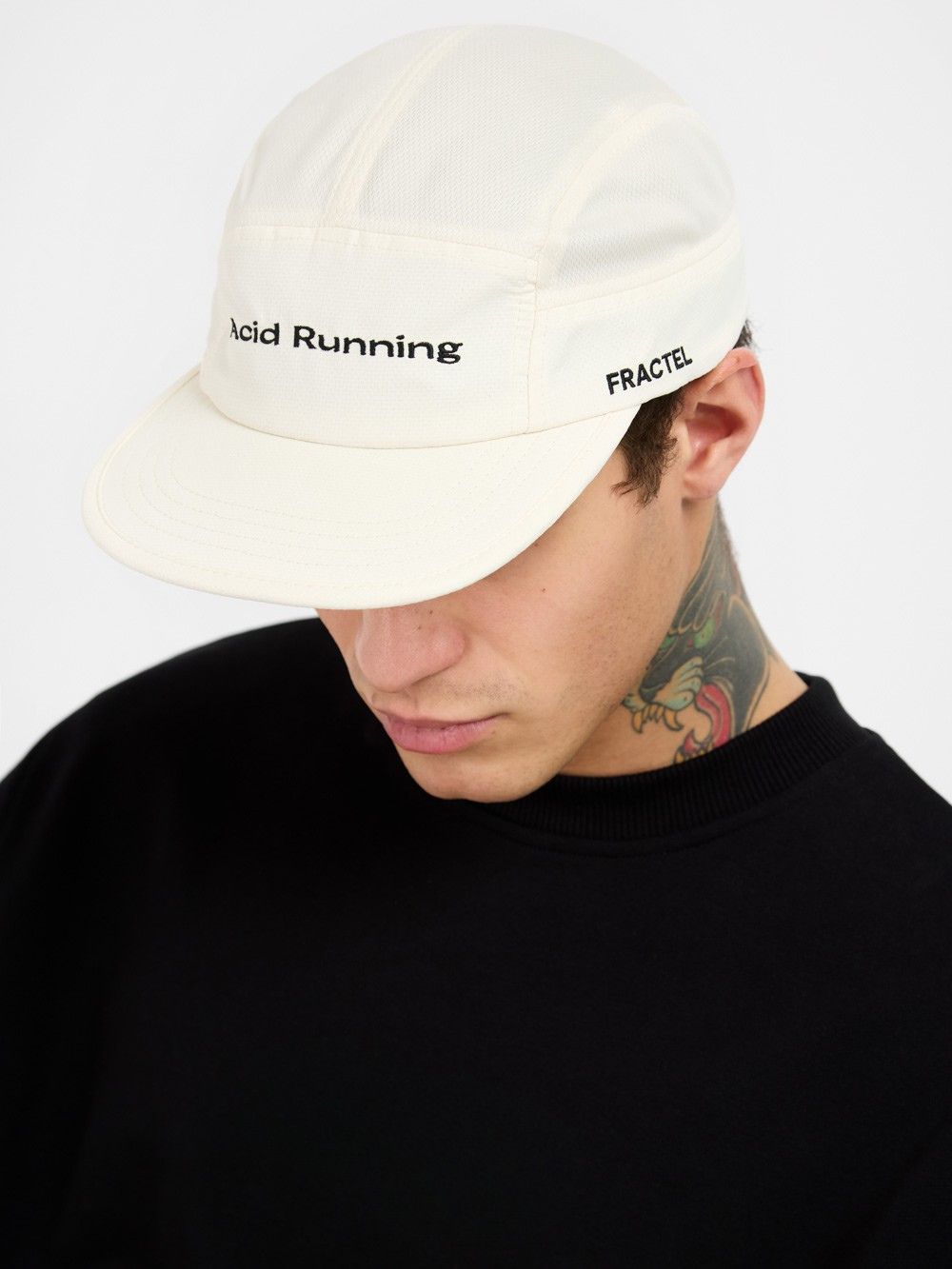 Acid x Fractel Cap in bone off-white with embroidered "Acid Running" front and "FRACTEL" side logos, lightweight and breathable design